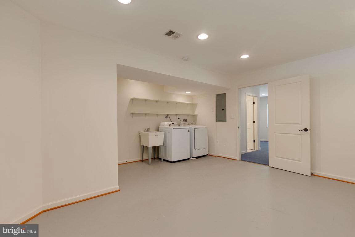 2104 Cartwright Place Reston, VA 20191 - Photo 20 of 30 Laundry nook with laundry tub and shelving