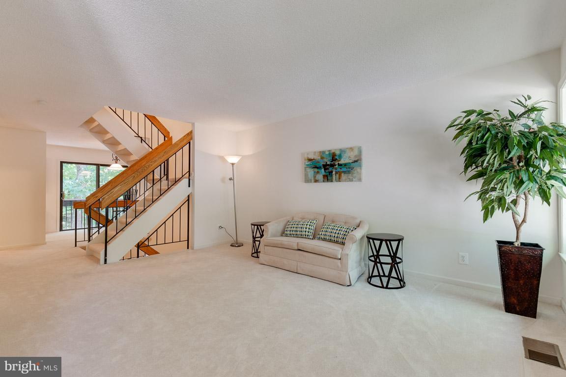2104 Cartwright Place Reston, VA 20191 - Photo 3 of 30 Large living room and open stair case