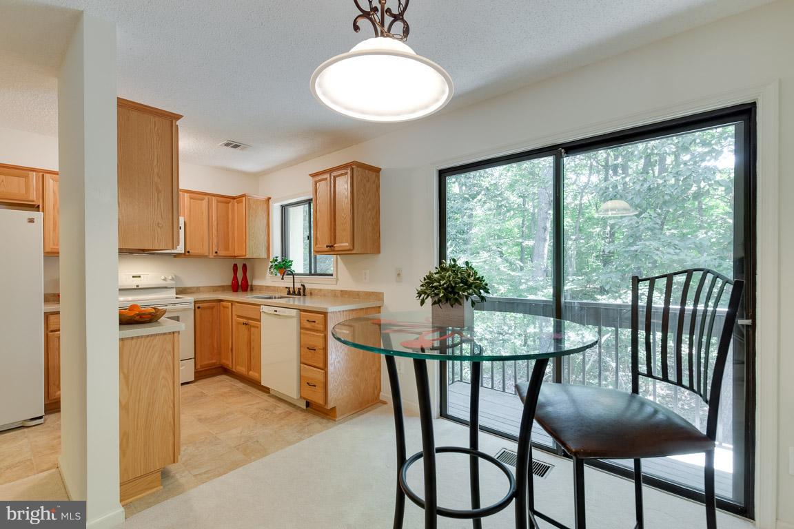 2104 Cartwright Place Reston, VA 20191 - Photo 7 of 30 Dining room open to kitchen and rear balcony