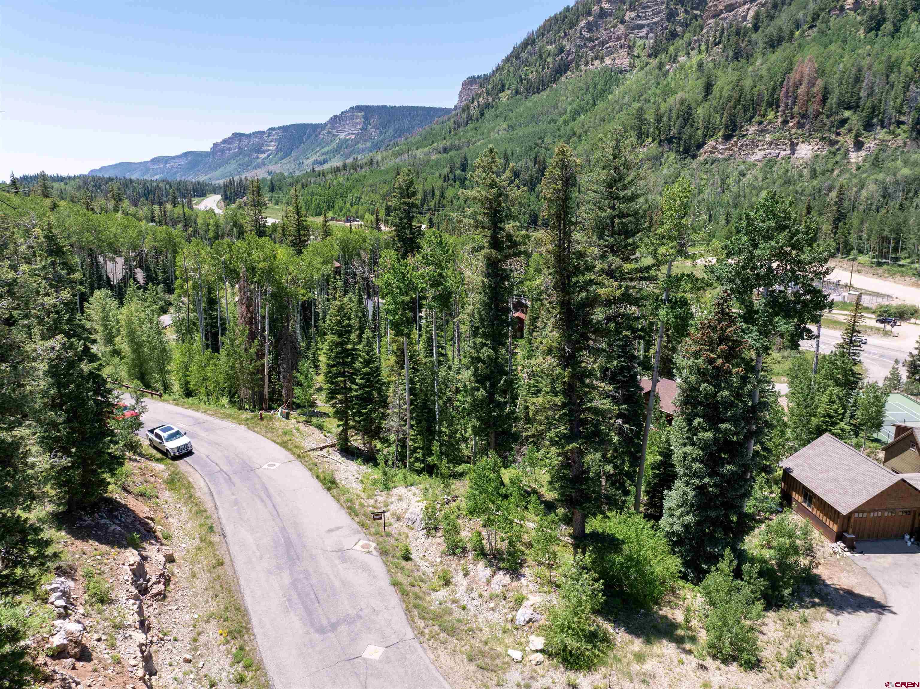 245 Engineer Drive Durango, CO 81301 - Photo 6 of 28 a view of a lush green forest with a building in the background