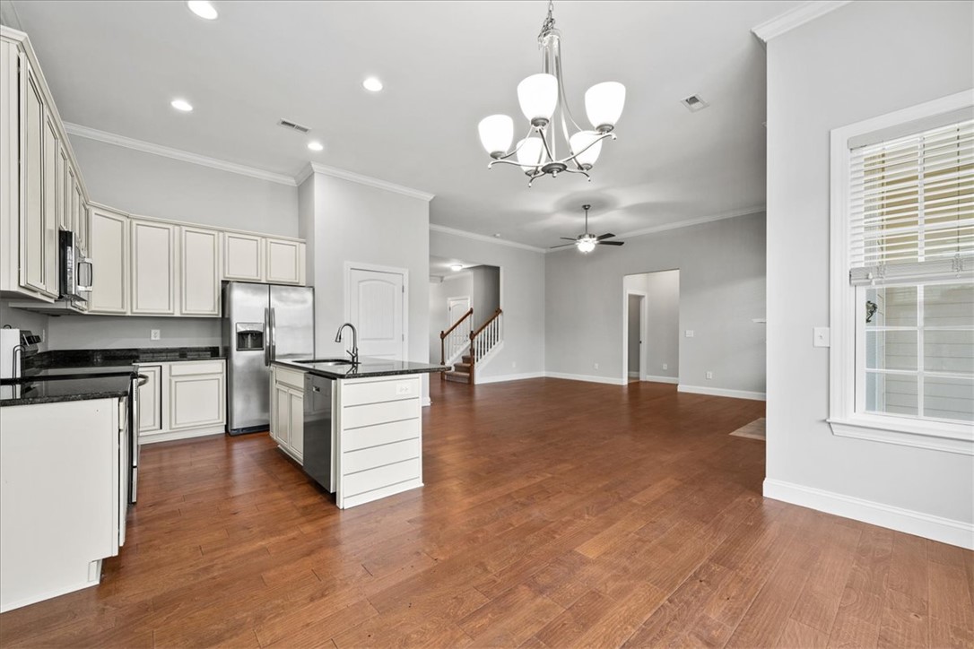 102 Ripplestone Way Anderson, SC 29621 - Photo 7 of 39 A grand, open-concept living space features warm hardwood floors and abundant natural light.
