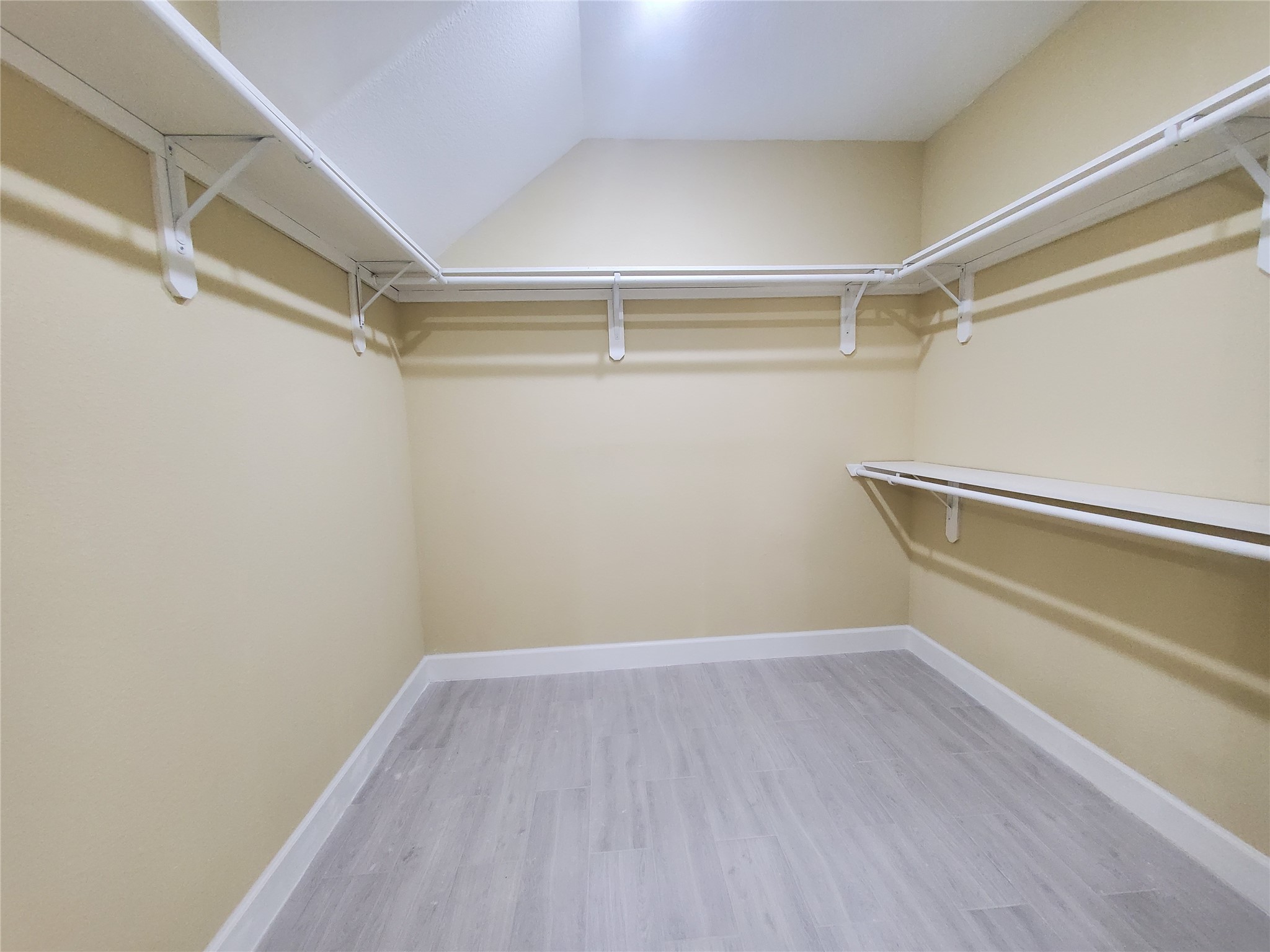 1306 North 9th Street Conroe, TX 77301 - Photo 12 of 47 a view of an empty walk in closet