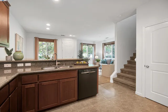 a kitchen with lots of counter space and sink