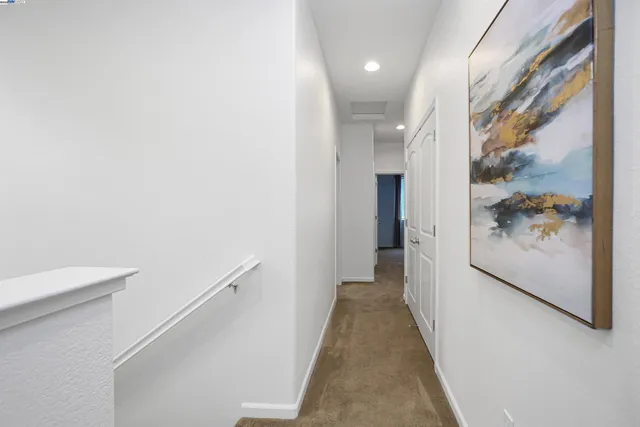 a view of a storage & utility room with dryer and washer