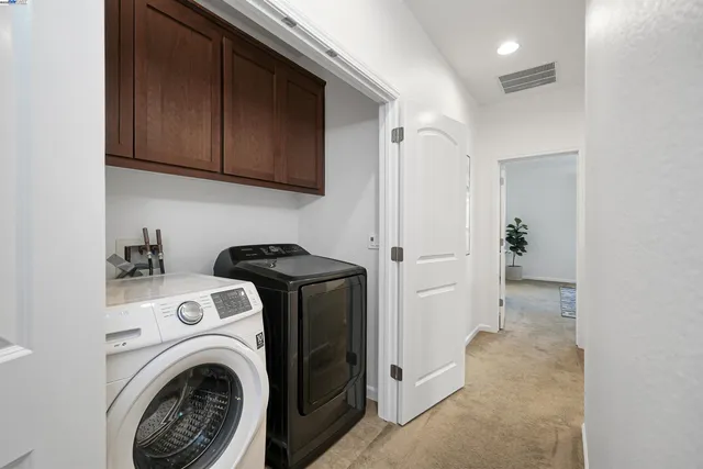 a bedroom with bed and a potted plant