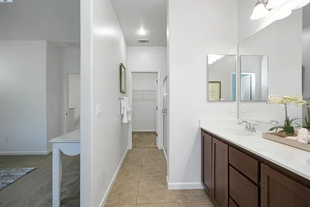 a bathroom with a double vanity sink mirror and double