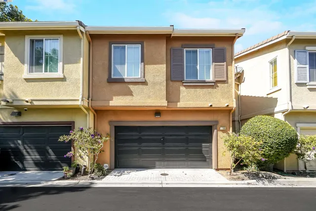 an aerial view of a house with a garden and balcony