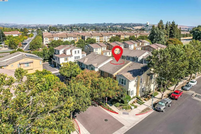an aerial view of residential houses with outdoor space