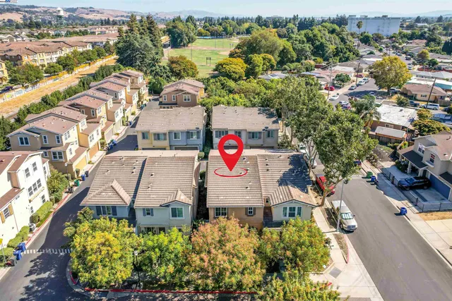an aerial view of residential building and parking space