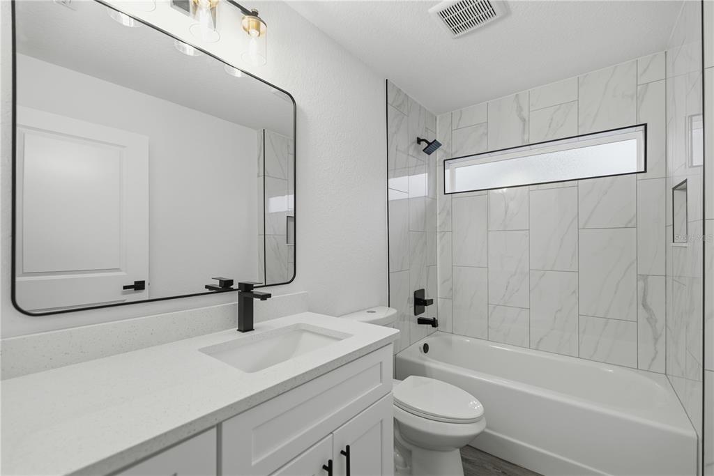 23 Juniper Loop Court Ocala, FL 34480 - Photo 15 of 25 a bathroom with a sink a toilet and shower