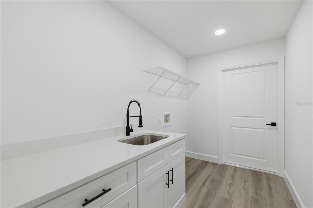 23 Juniper Loop Court Ocala, FL 34480 - Photo 18 of 25 a kitchen with a sink and cabinets