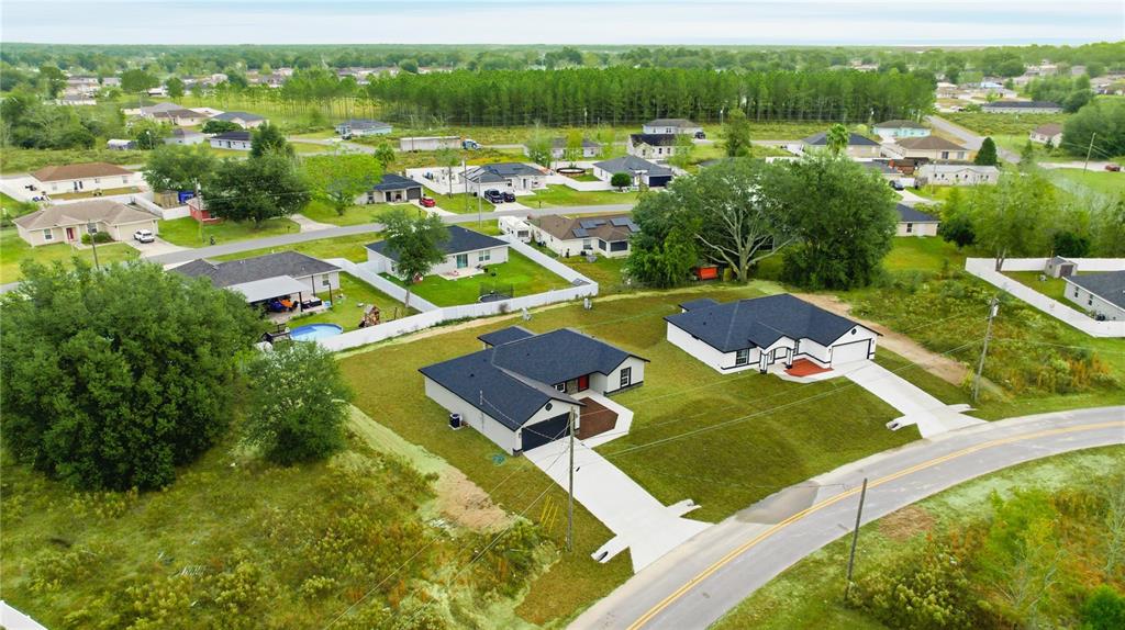 23 Juniper Loop Court Ocala, FL 34480 - Photo 19 of 25 a view of a lake with a house