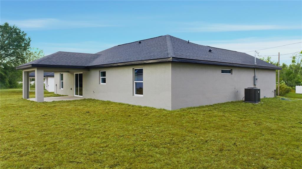 23 Juniper Loop Court Ocala, FL 34480 - Photo 21 of 25 a house with yard in front of it