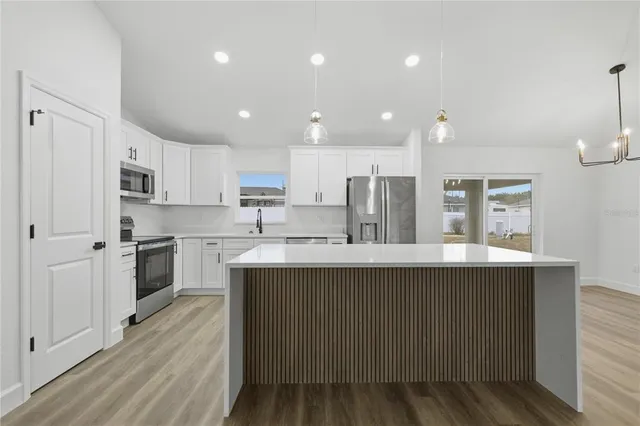 a kitchen with counter top space cabinets and a sink