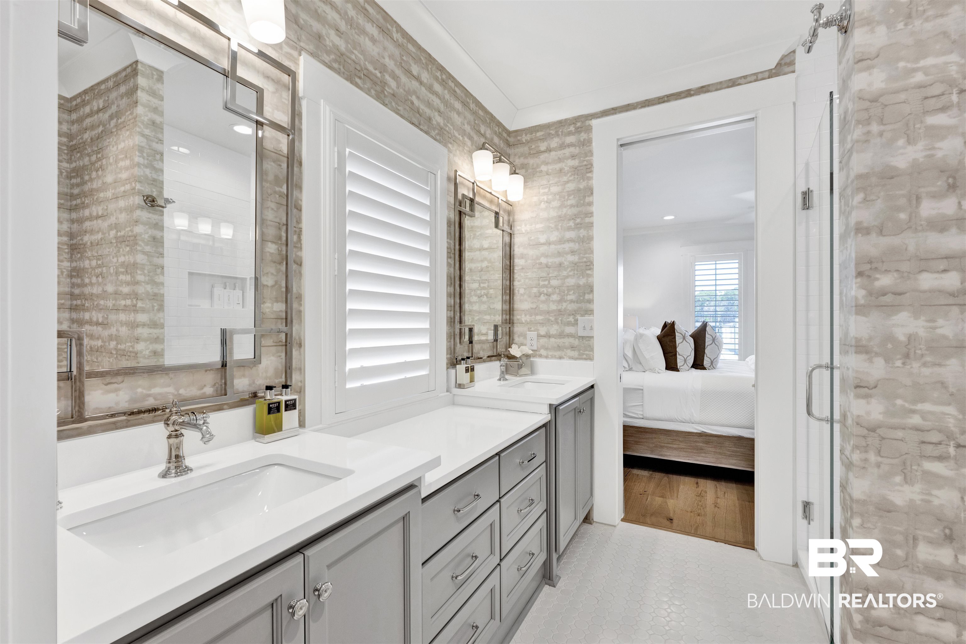 861 Inlet Circle Gulf Shores, AL 36542 - Photo 34 of 54 Bathroom with ensuite bath, two vanities, crown molding, and an enclosed shower