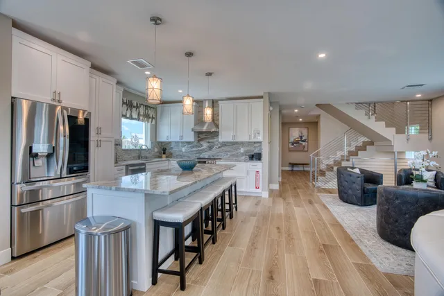 a bedroom with a large bed and a large window