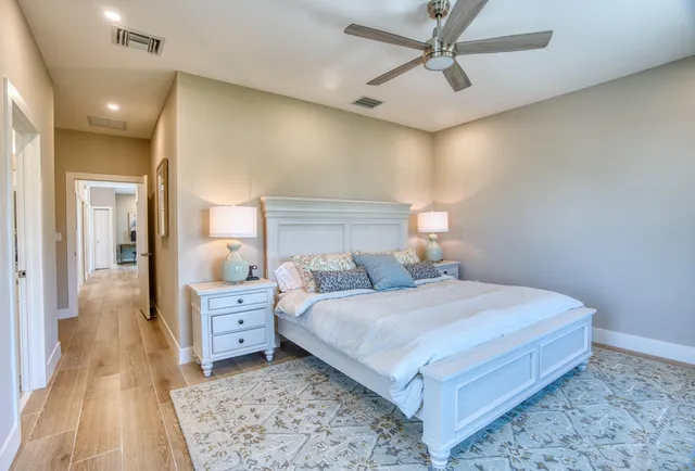 a bedroom with a bed and a dresser