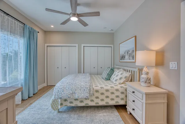 a bedroom with a large bed and a dresser