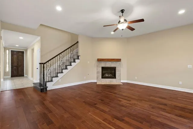 wooden floor in an empty room with a fireplace