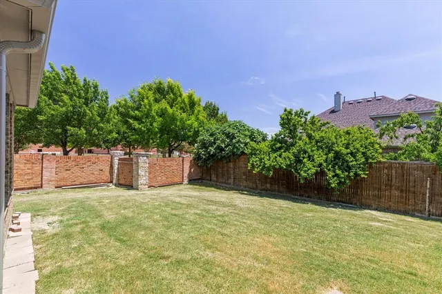 a house with yard in front of it