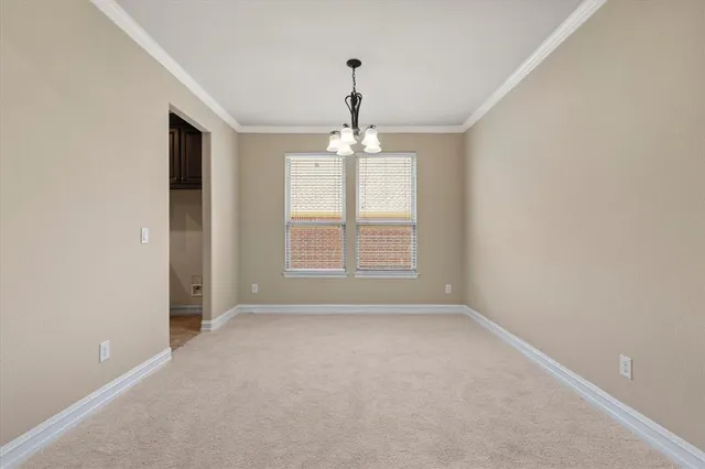 a view of a room with windows and chandelier