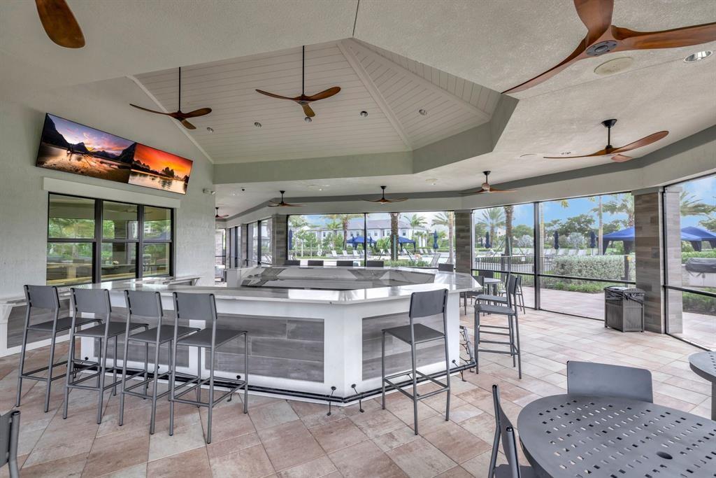 2178 Appleton Circle South Oakland Park, FL 33309 - Photo 15 of 22 a room with lots of tables a large window and chairs