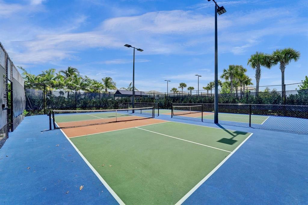 2178 Appleton Circle South Oakland Park, FL 33309 - Photo 18 of 22 a view of a tennis court with a palm tree
