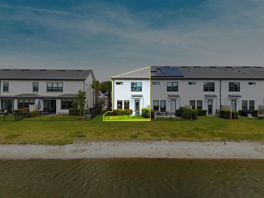 2178 Appleton Circle South Oakland Park, FL 33309 - Photo 2 of 22 a front view of a house with a garden and porch