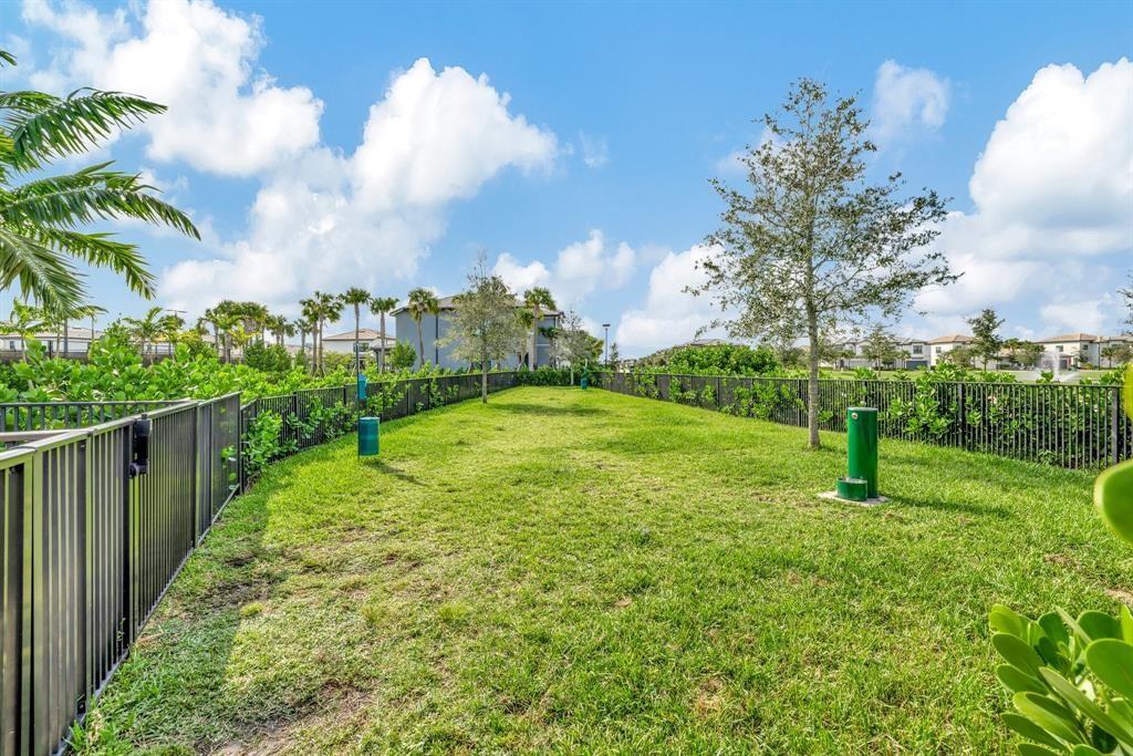 2178 Appleton Circle South Oakland Park, FL 33309 - Photo 22 of 22 a view of a garden with a fountain