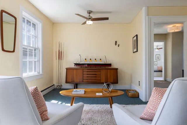 a living room with furniture and a table