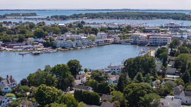 an aerial view of a houses with a lake view