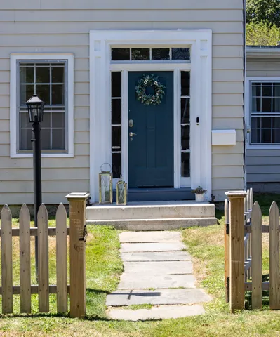 a view of fountain in front of a house