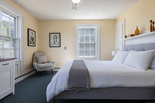 a bedroom with a bed and a couch