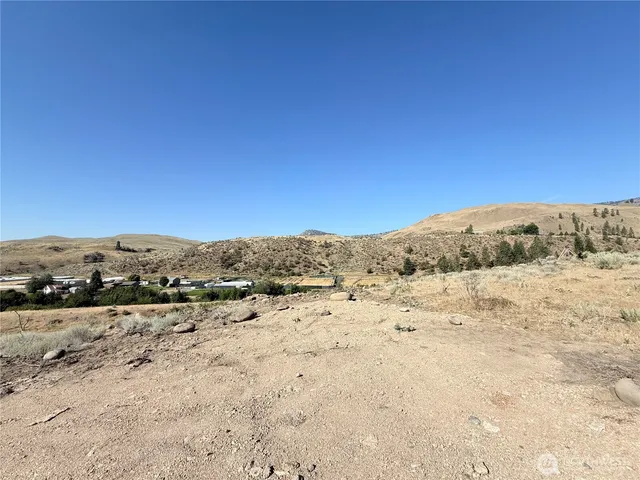 a view of mountain view with mountain and trees in the background