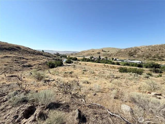 a view of ocean beach and mountain