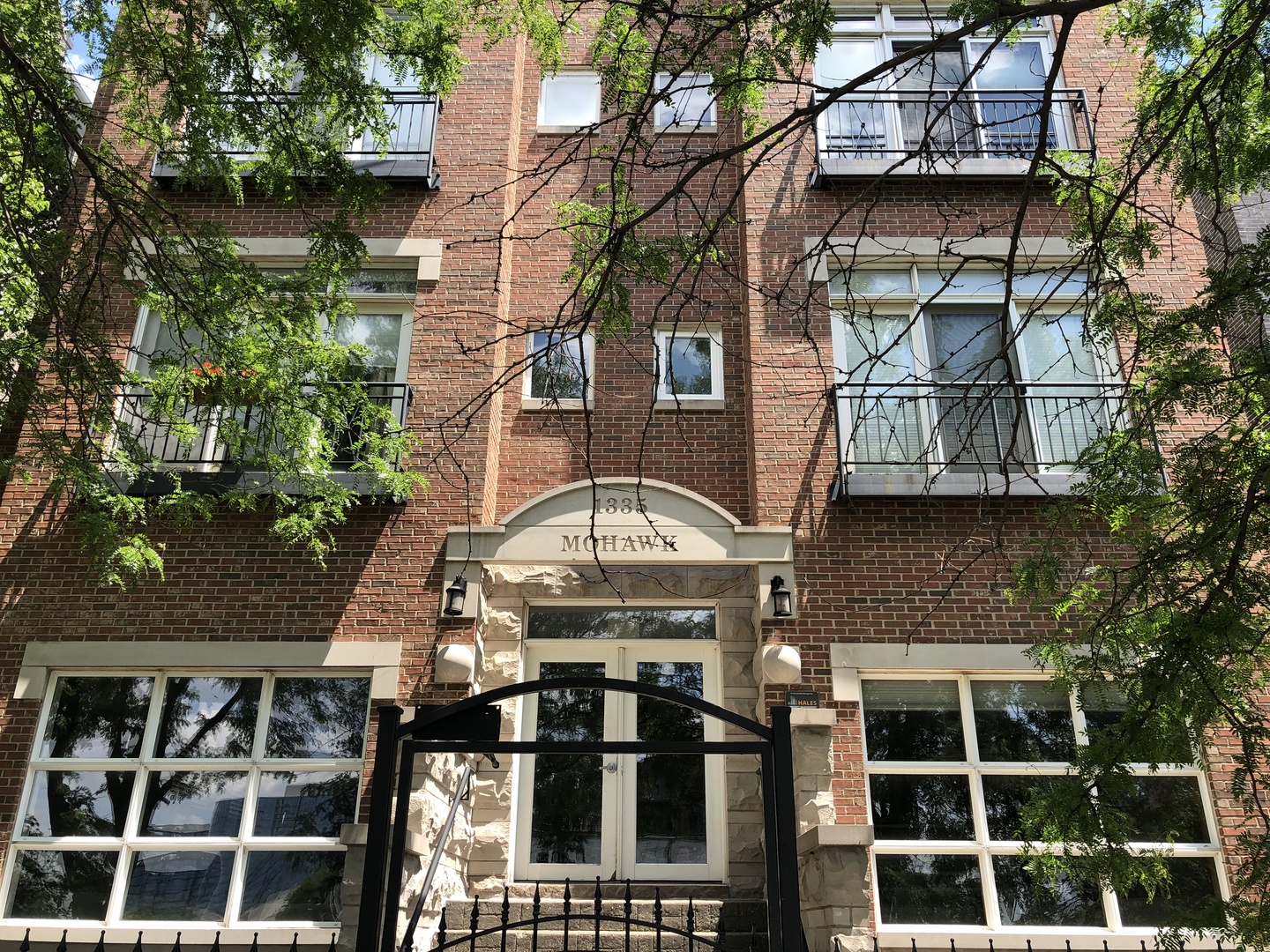 1335 North Mohawk Street, Unit 2N Chicago, IL 60610 - Photo 1 of 15 front view of a brick house with a large window