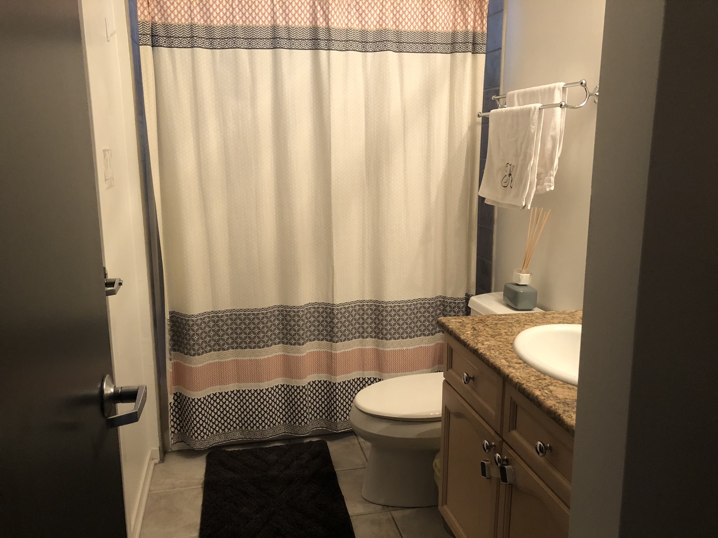1335 North Mohawk Street, Unit 2N Chicago, IL 60610 - Photo 15 of 15 a bathroom with a sink a toilet and shower curtain