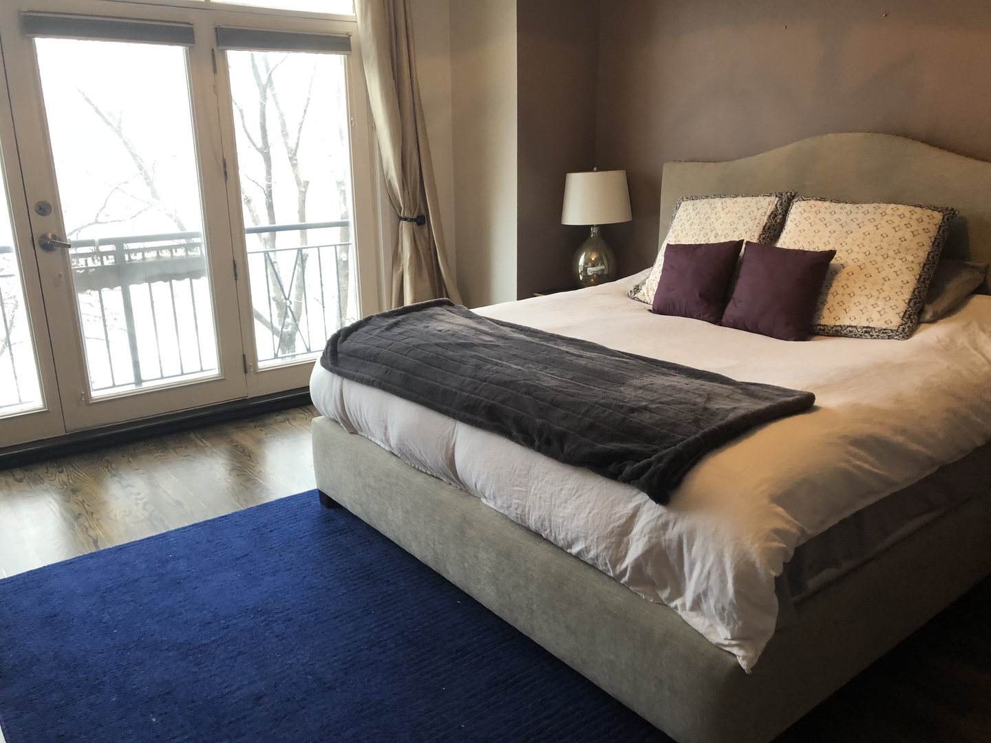 1335 North Mohawk Street, Unit 2N Chicago, IL 60610 - Photo 8 of 15 a large bed sitting in a bedroom next to a window