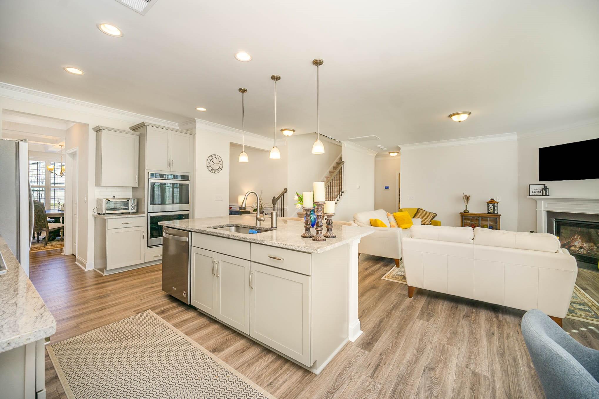 6029 Redwood Pine Road Concord, NC 28027 - Photo 15 of 48 a large white kitchen with cabinets a sink and a stove
