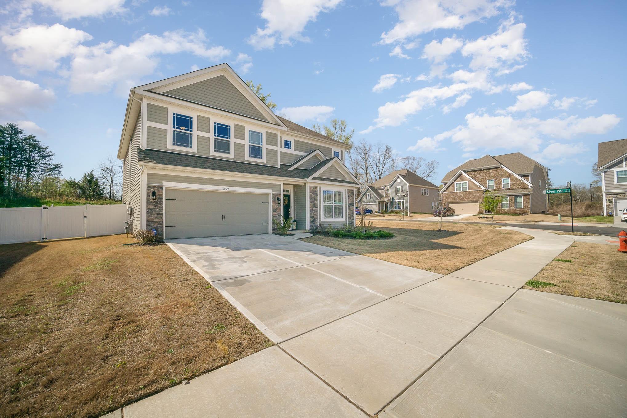 6029 Redwood Pine Road Concord, NC 28027 - Photo 2 of 48 a house view with a garden space