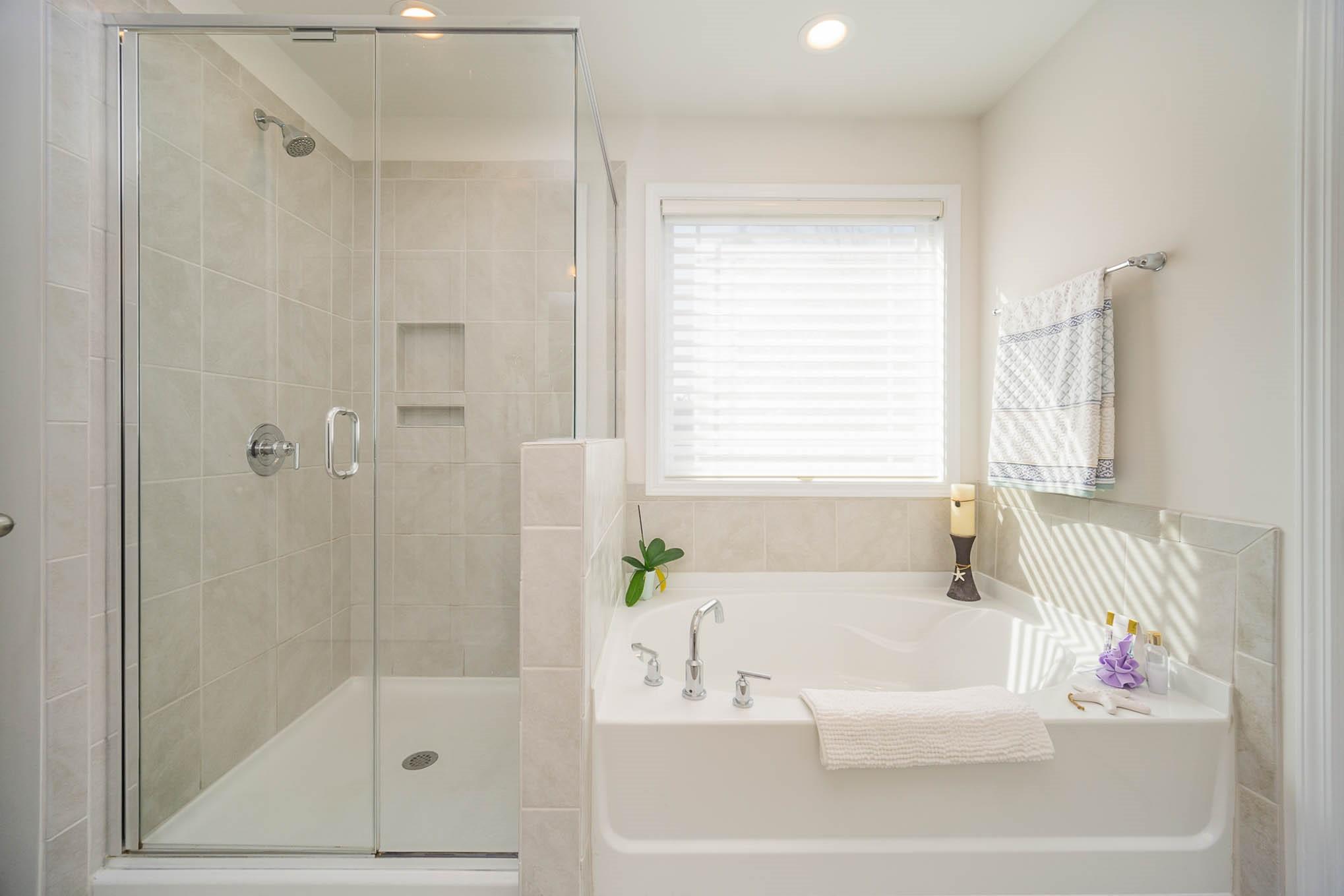 6029 Redwood Pine Road Concord, NC 28027 - Photo 23 of 48 a white bath tub sitting next to a shower