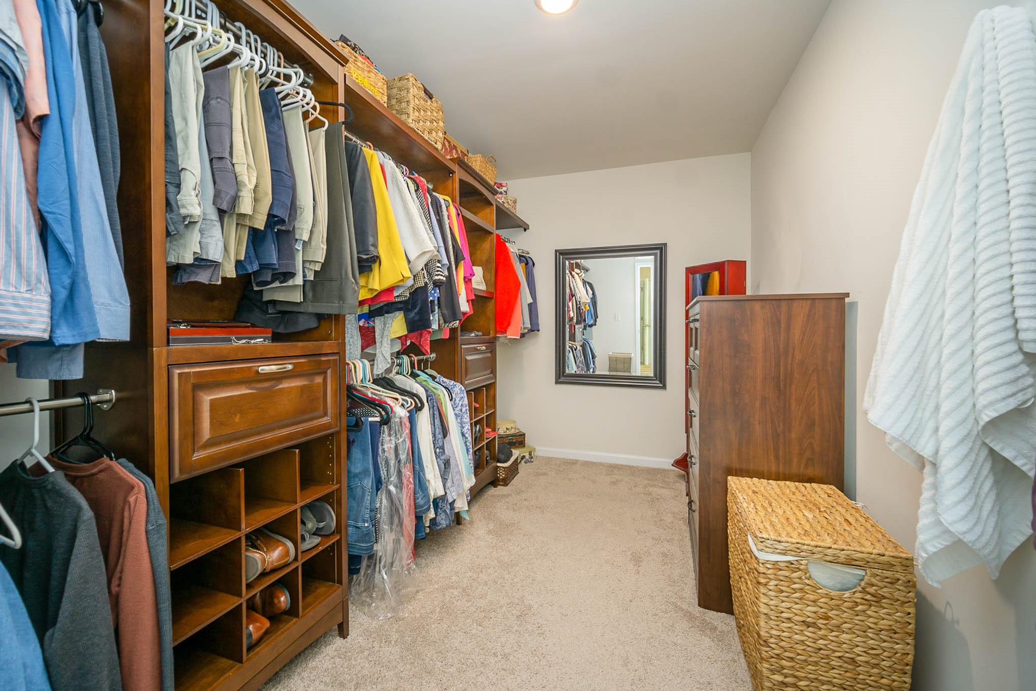 6029 Redwood Pine Road Concord, NC 28027 - Photo 24 of 48 a view of walk in closet with clothes and shoes