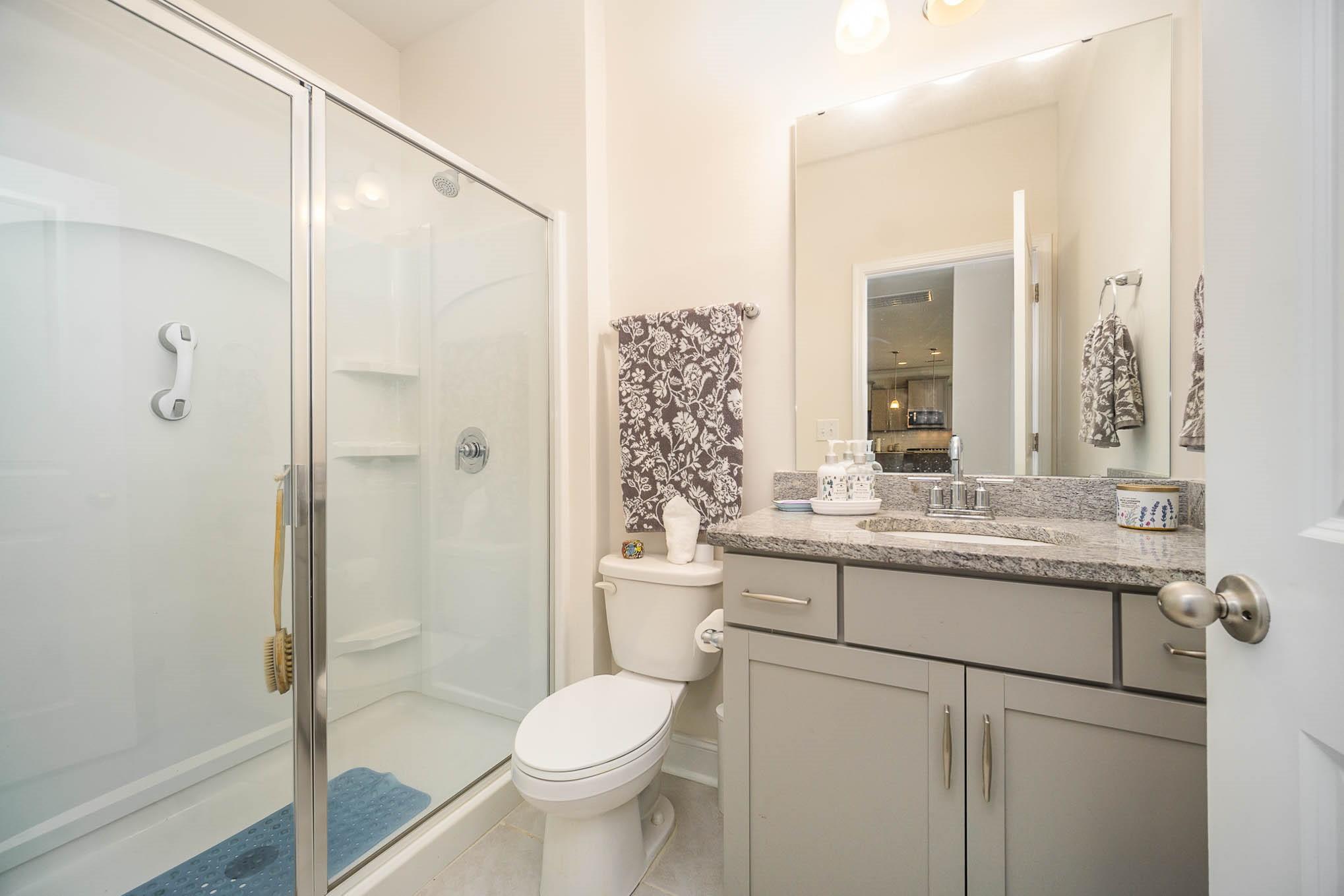 6029 Redwood Pine Road Concord, NC 28027 - Photo 35 of 48 a bathroom with a granite countertop sink toilet and shower