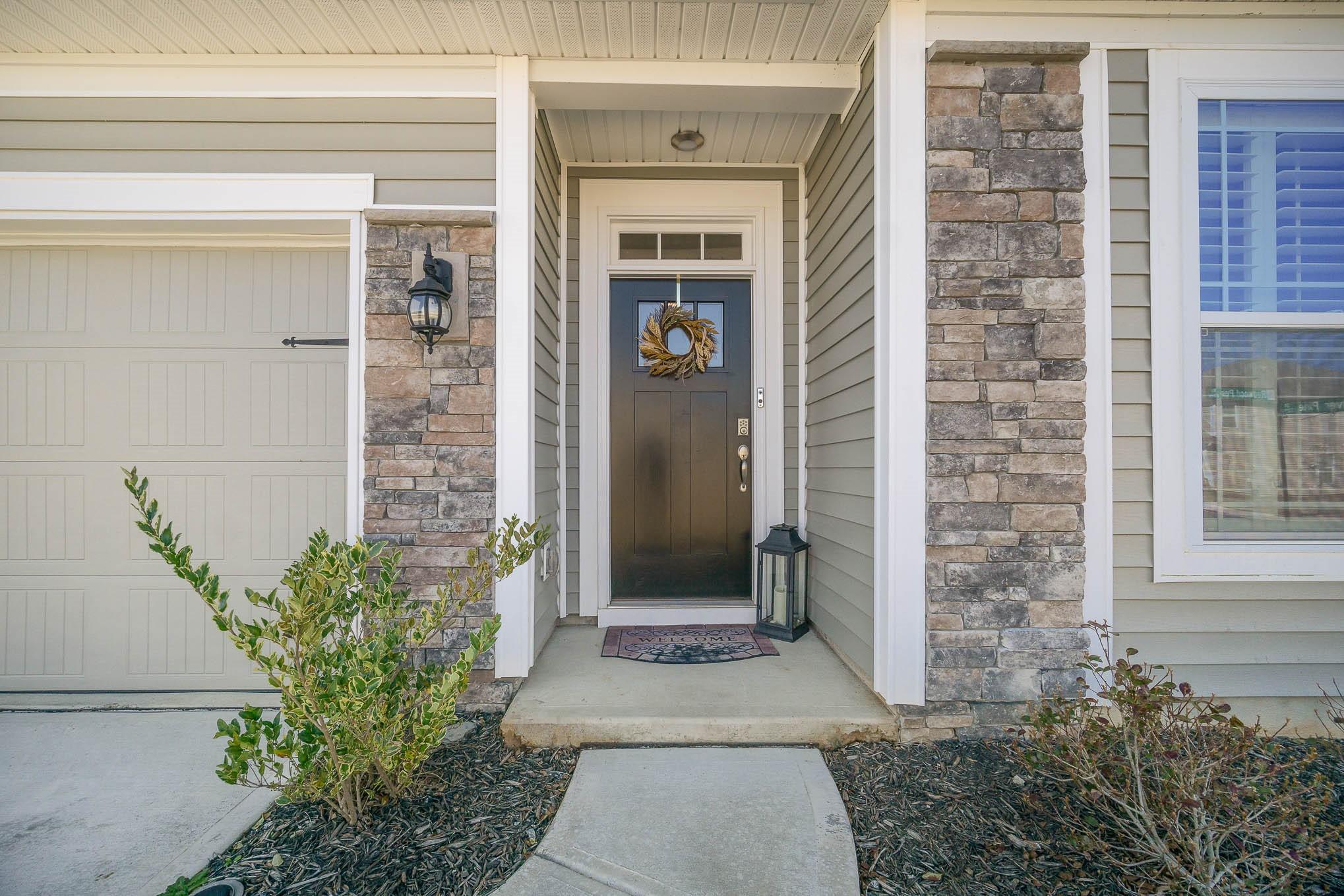 6029 Redwood Pine Road Concord, NC 28027 - Photo 4 of 48 a view of a entryway door of the house