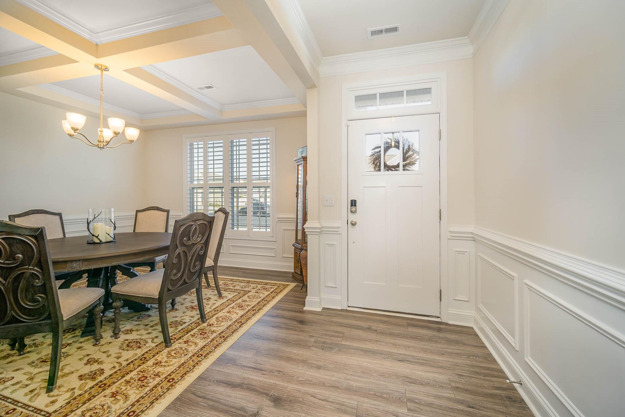 6029 Redwood Pine Road Concord, NC 28027 - Photo 5 of 48 a view of a dining room with furniture and wooden floor