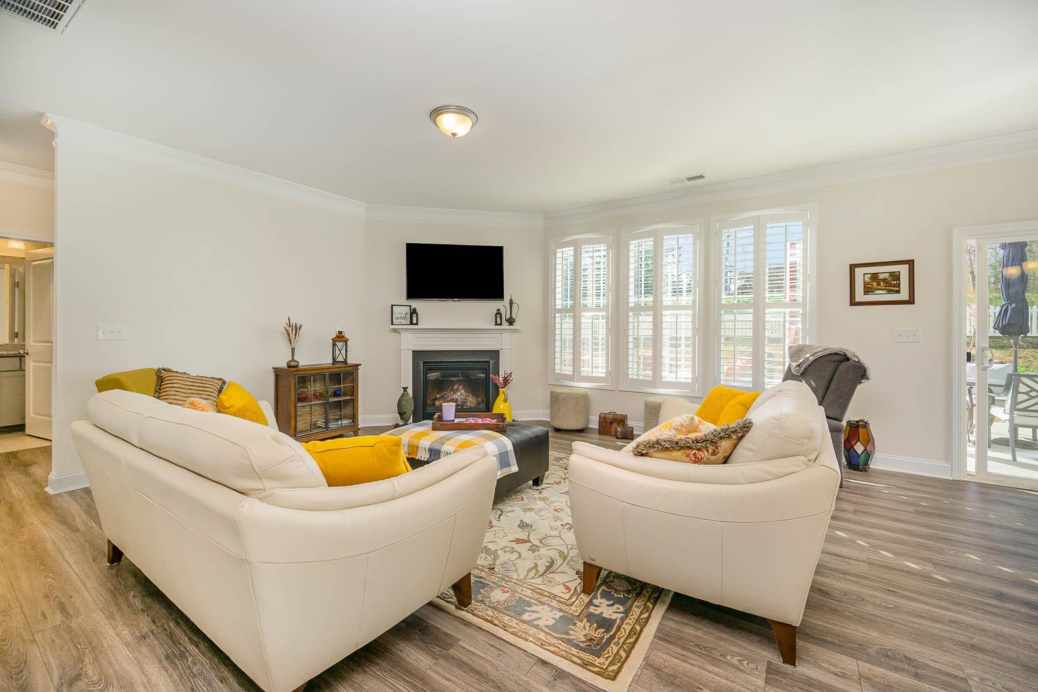 6029 Redwood Pine Road Concord, NC 28027 - Photo 9 of 48 a living room with fireplace furniture and a flat screen tv