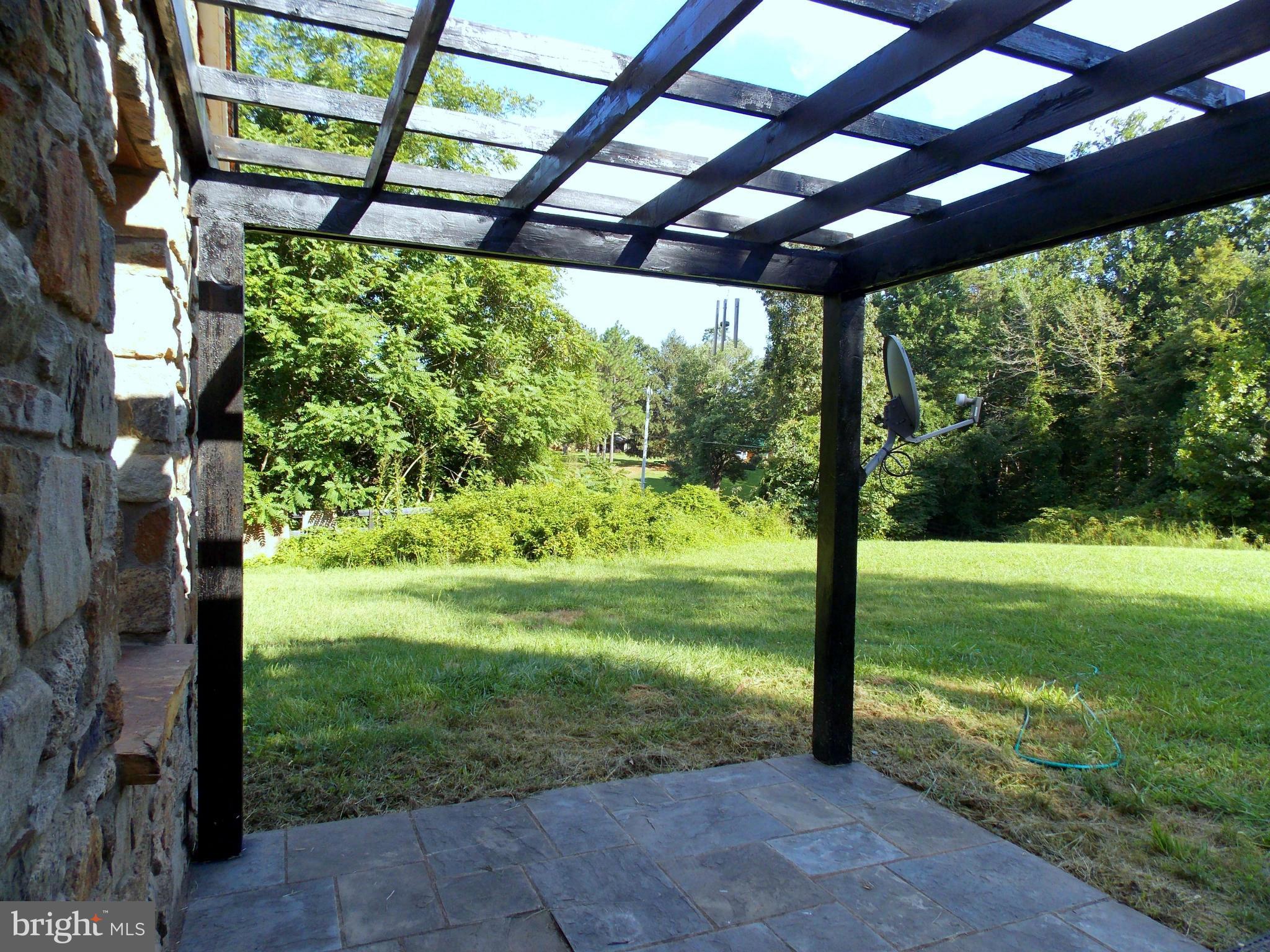 7032 Olinger Road Marshall, VA 20115 - Photo 3 of 19 Front Entryway Trellis covered Patio