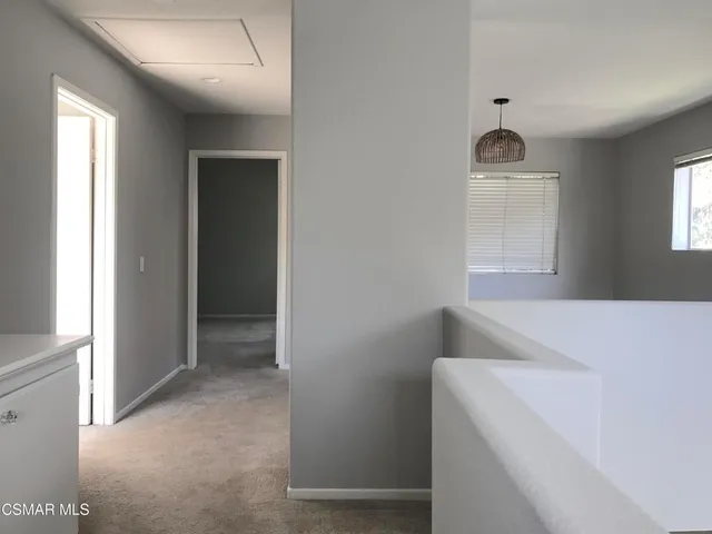 a bathroom with a double vanity sink a mirror and a bathtub