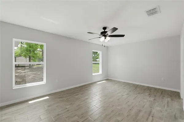 a view of an empty room with a window