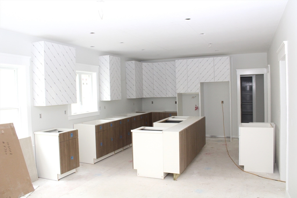 30 Mendon Street Upton, MA 01568 - Photo 13 of 26 a kitchen with a sink a counter top space and cabinets